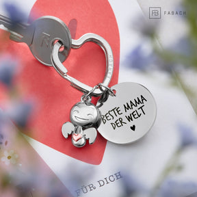 "Beste Mama" Schutzengel Schlüsselanhänger - Schutzengel Happy mit Herz und Gravur Plättchen mit liebevoller Botschaft - FABACH – Die Schlüsselanhänger - Schmiede